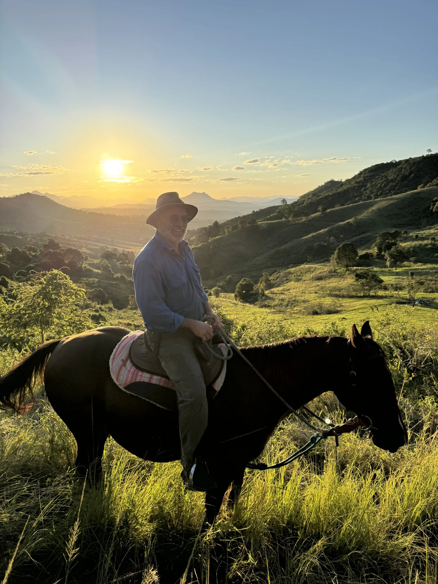 Checking the herd on horseback at sundown
